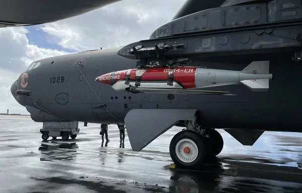 An inert Joint Direct Attack Munition Quickstrike Extended Range mine is attached to a US Air Force B-52H Stratofortress at Barksdale Air Force Base, Louisiana, in early March 2023. [US Air Force]