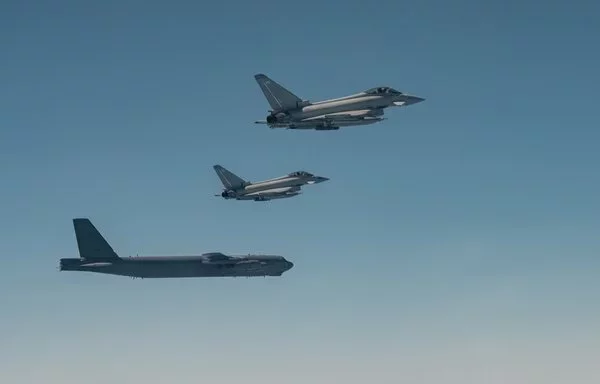 A US Air Force B-52H Stratofortress (left) flies alongside two Royal Air Force Eurofighter Typhoons in the US Central Command area of responsibility November 18. [US Air Force]