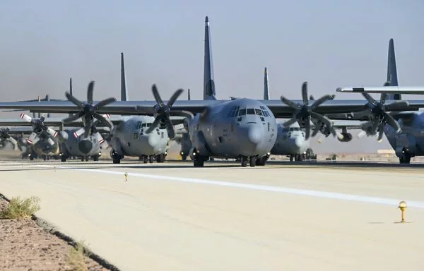 US Air Force and coalition partnered aircraft taxi onto a runway to conduct an elephant walk during Exercise TUWAIQ-4 within the US Central Command area of responsibility December 7. [US Air Force]