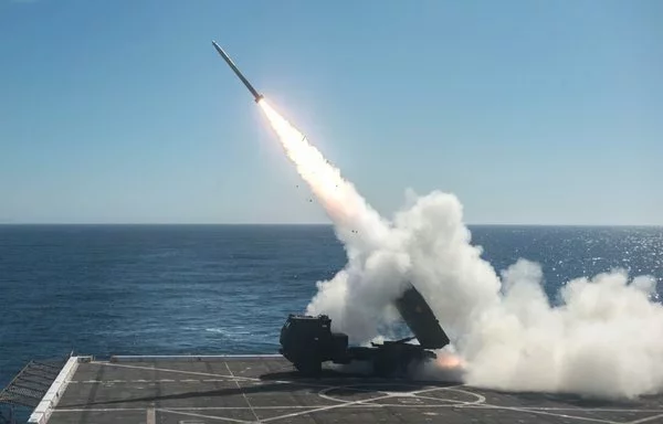 A High Mobility Artillery Rocket System (HIMARS) is fired from the USS Anchorage during Dawn Blitz 2017. [US Navy]