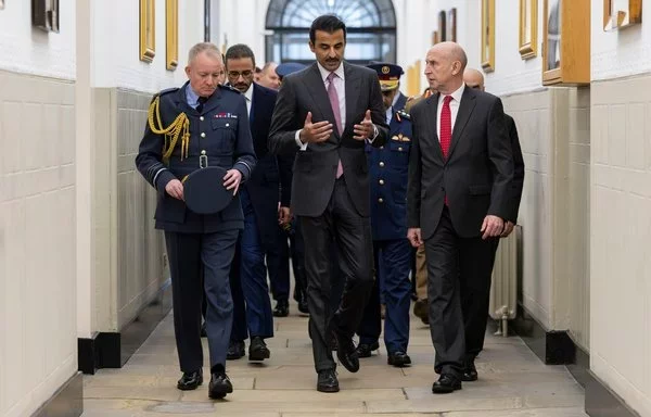 Tamim bin Hamad Al Thani (center) speaks with UK Defense Secretary John Healey (right) during his state visit to the United Kingdom in December. [UK Ministry of Defense]