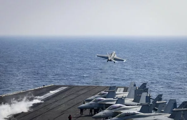 An F/A-18E Super Hornet launches from the flight deck of the USS Harry S. Truman in the US Central Command area of responsibility on January 5. [US Navy]