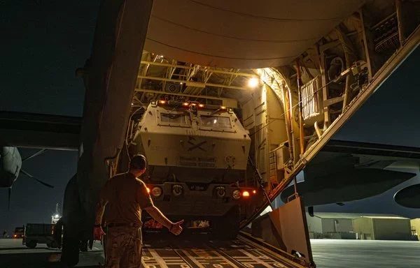 A US Army loadmaster directs a HIMARS onto an MC-130J Commando II for a training exercise within CENTCOM's area of responsibility last October 16. [US Air Force]