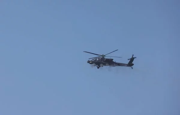 An AH-64 Apache fires off 30mm M230 Chain Gun rounds during a training exercise at Fort Liberty, North Carolina, on February 6. [US Army]